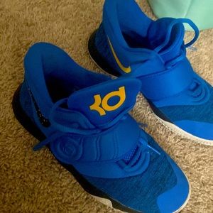 Blue youth Nike tennis shoes boys
